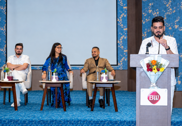 Conference Panel with Floral Backdrop